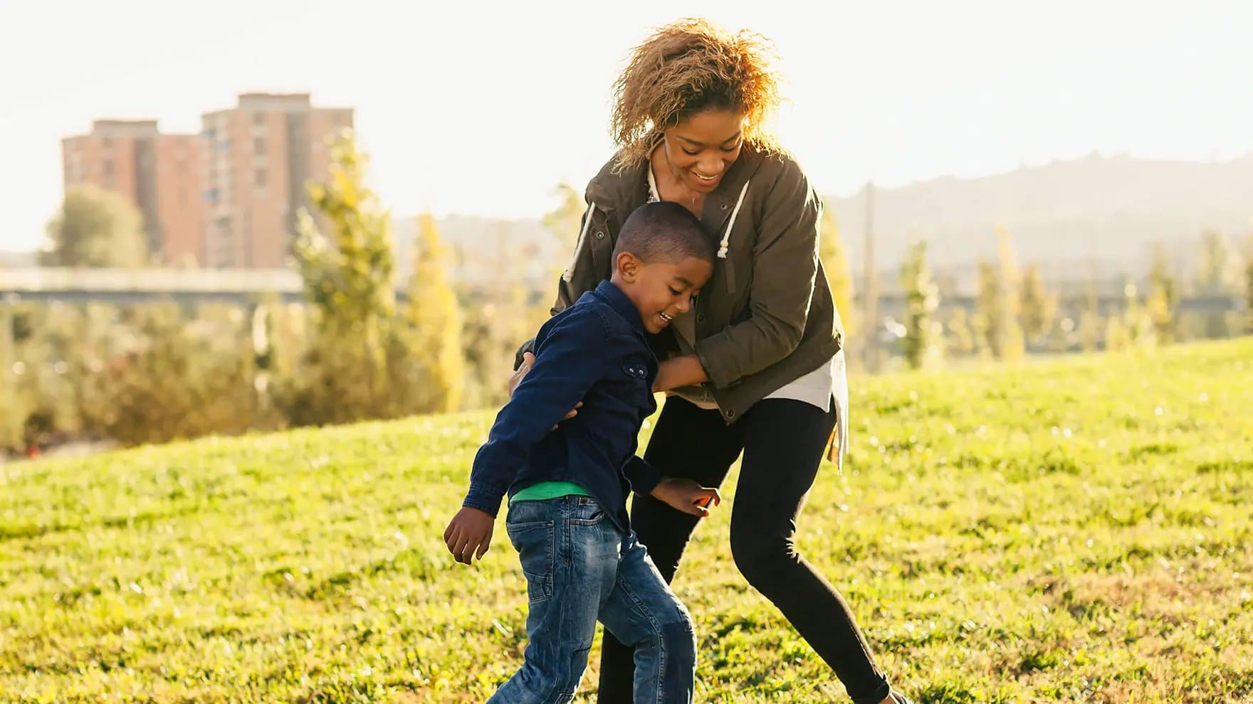 Parent and child playing outdoors